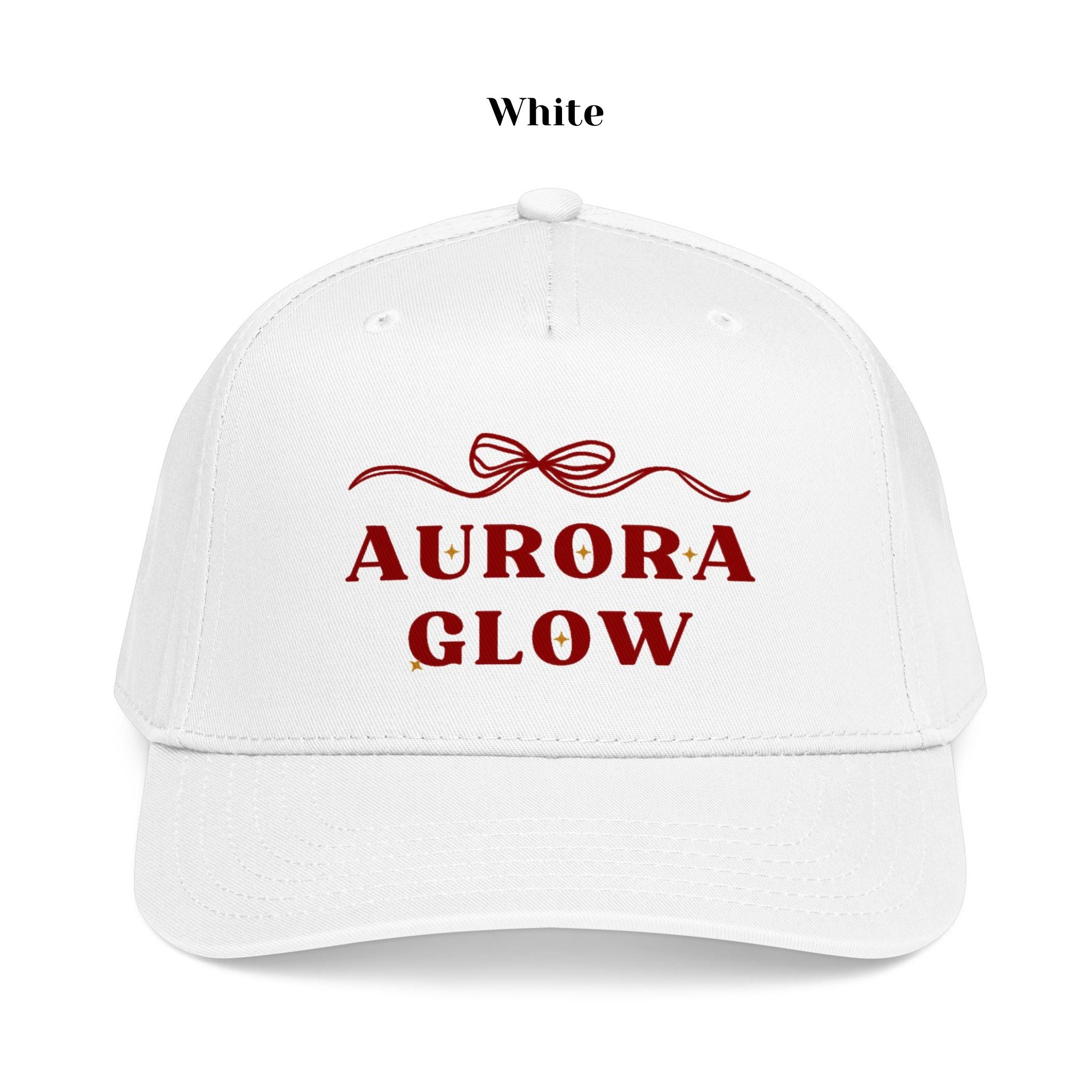 White Aurora Glow Trucker Hat by Hello Aurie styled casually, featuring delicate bow graphic and vibrant DTF print.