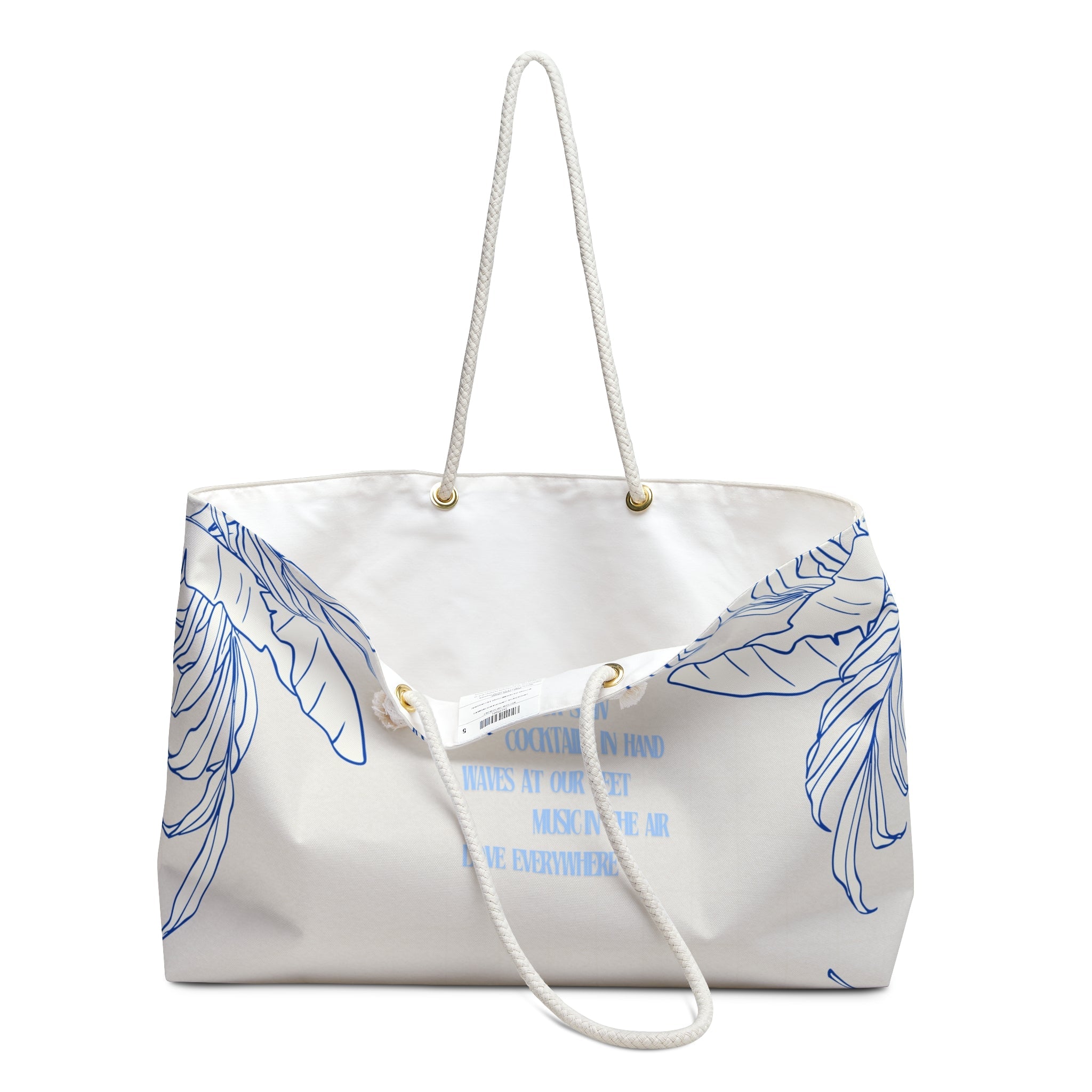 Nature-inspired blue leaf canvas tote bag on neutral fabric