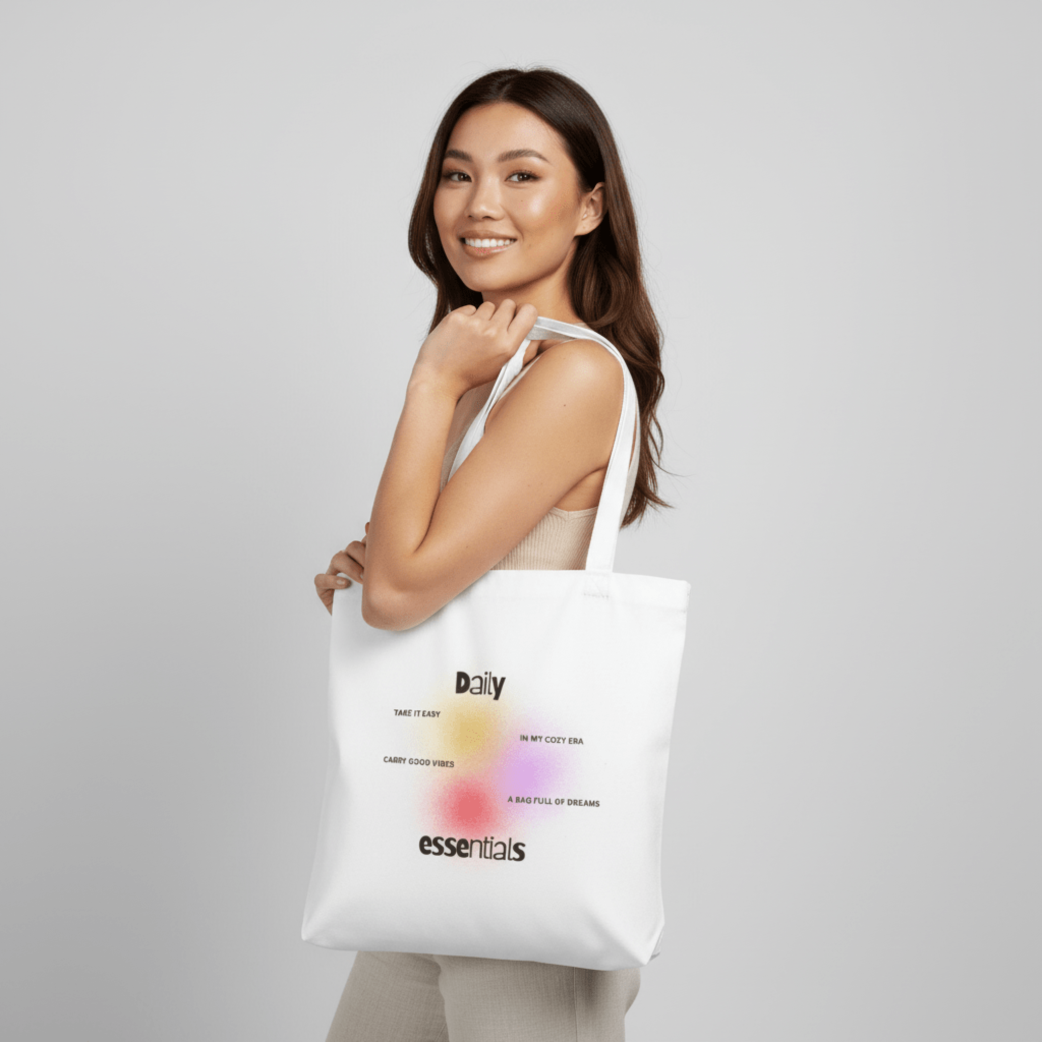 Tote bag with uplifting typography reading Daily Essentials, Take It Easy, and Carry Good Vibes, modern feel-good everyday bag