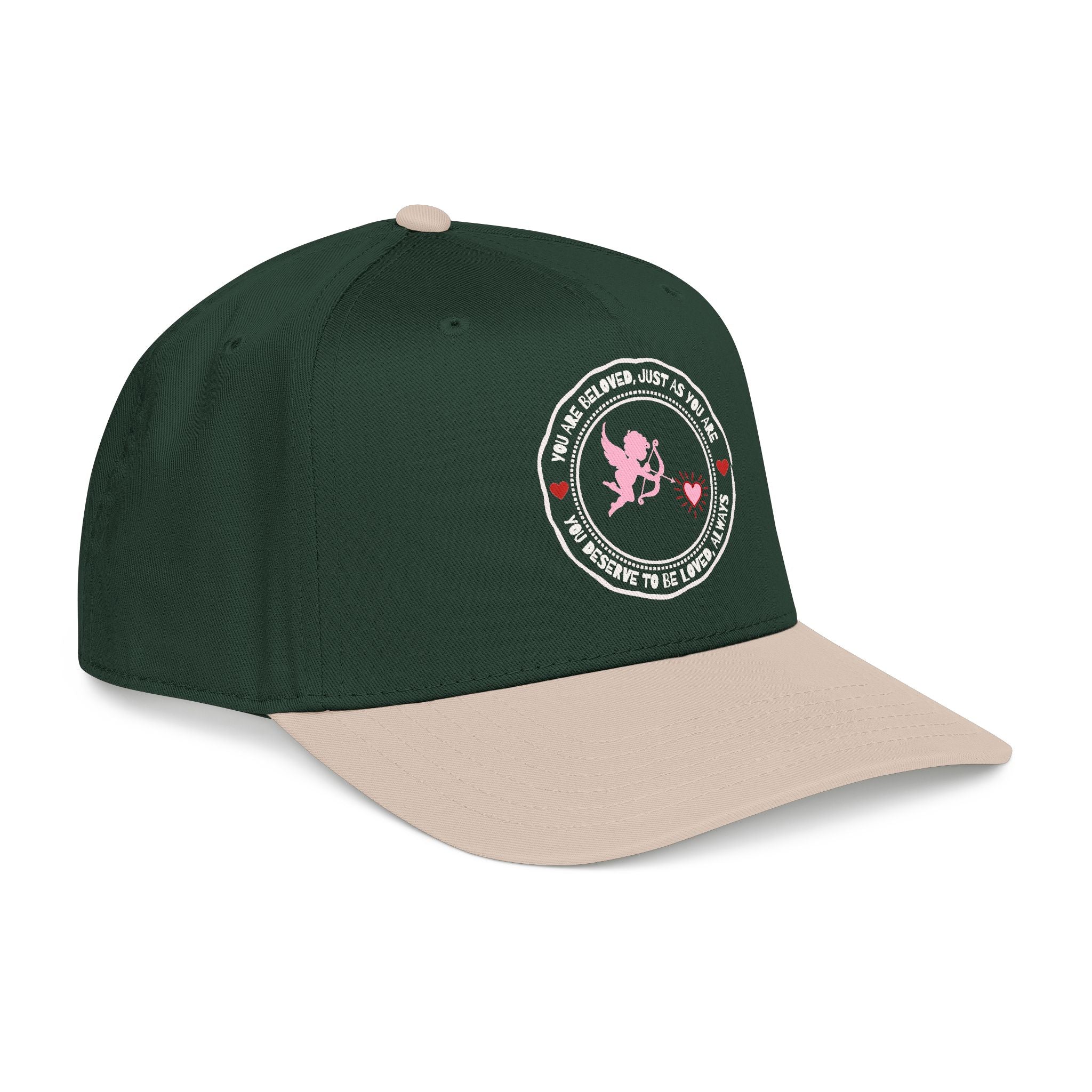 Side view of Cupid’s Embrace Trucker khaki dark green Hat with “You Are Beloved” embroidery in red heart design