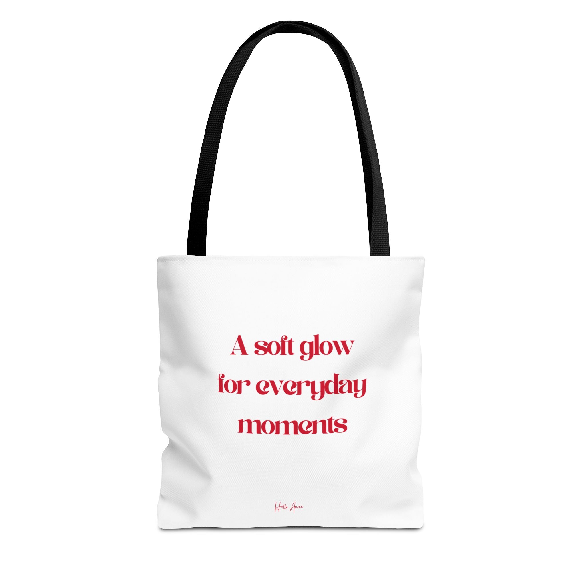 White tote bag with red text and black handle on a white background