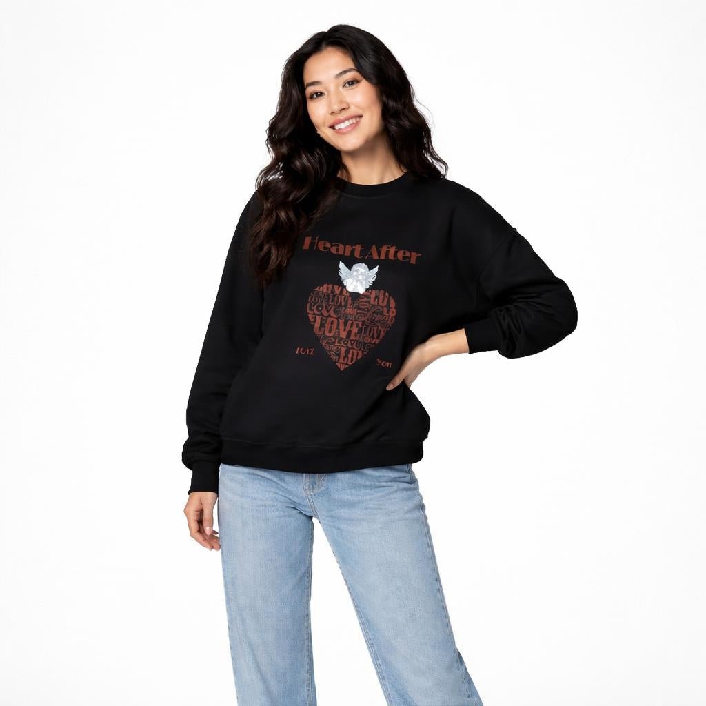 Black crewneck sweatshirt with “Heart After” text and angel graphic above a love typography heart design.