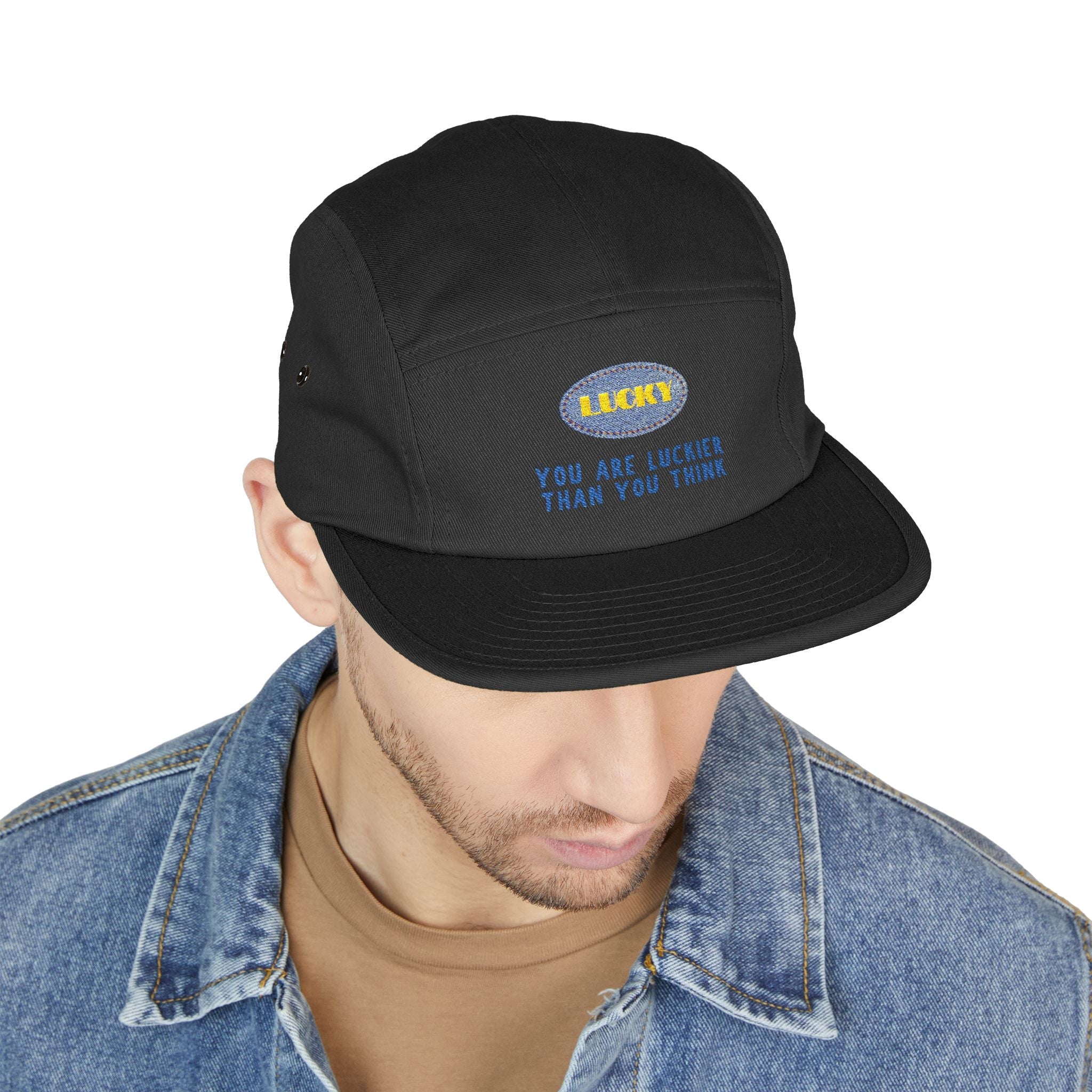 Front view of 5-panel cap featuring oval lucky embroidery and positive quote