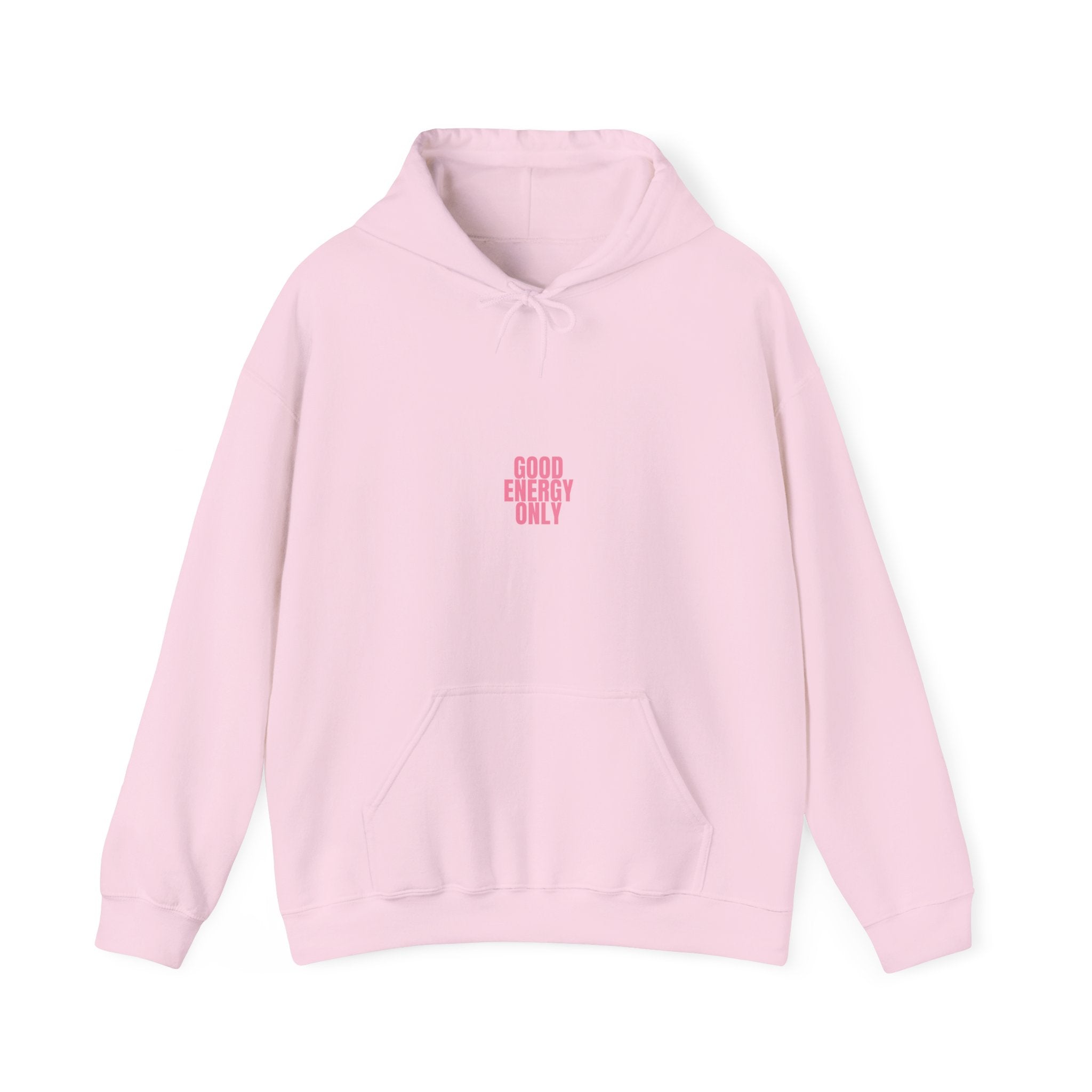 Close-up of pink typography hoodie featuring “Good Energy Only” and uplifting smile quote design